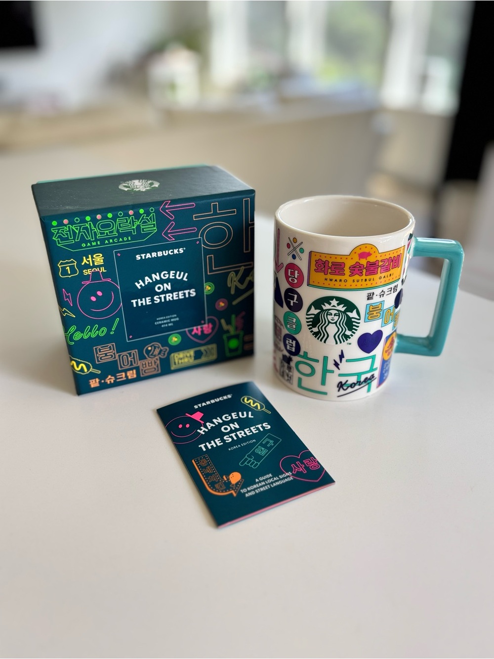 Starbucks White Mug with Teal Handle and Hangeul Sticker Graphics from Korea